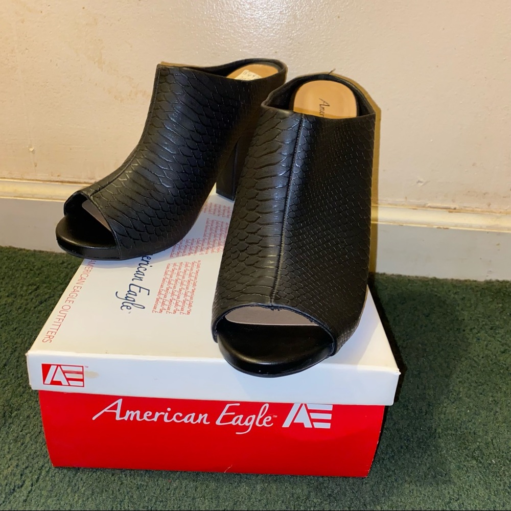 Black peep-toe heeled slides